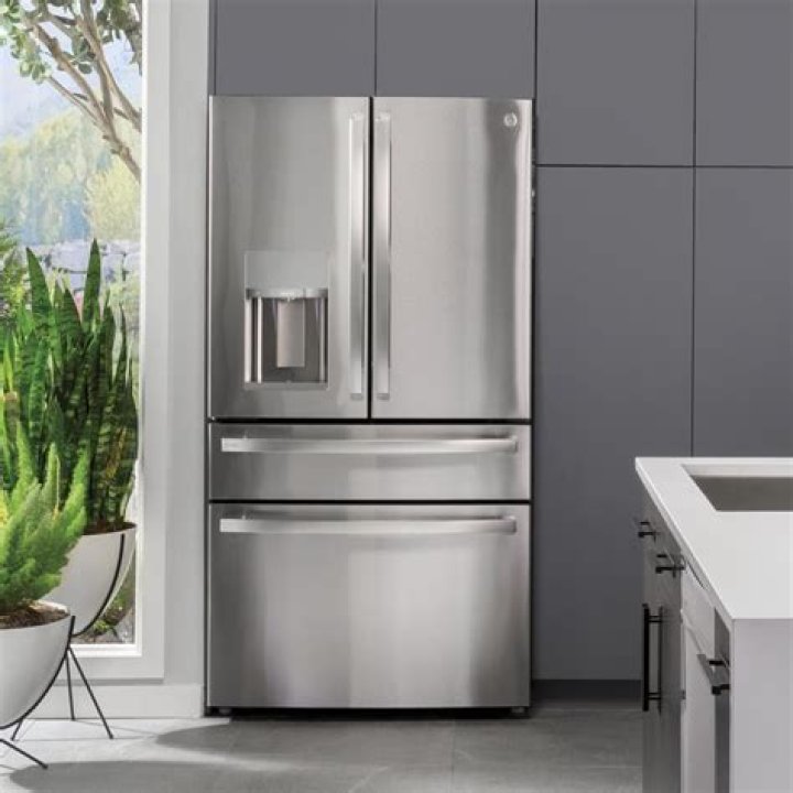 Can a refrigerator share an outlet with a TV?
