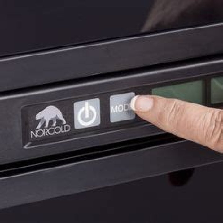 How do you adjust the temperature on a Norcold RV?