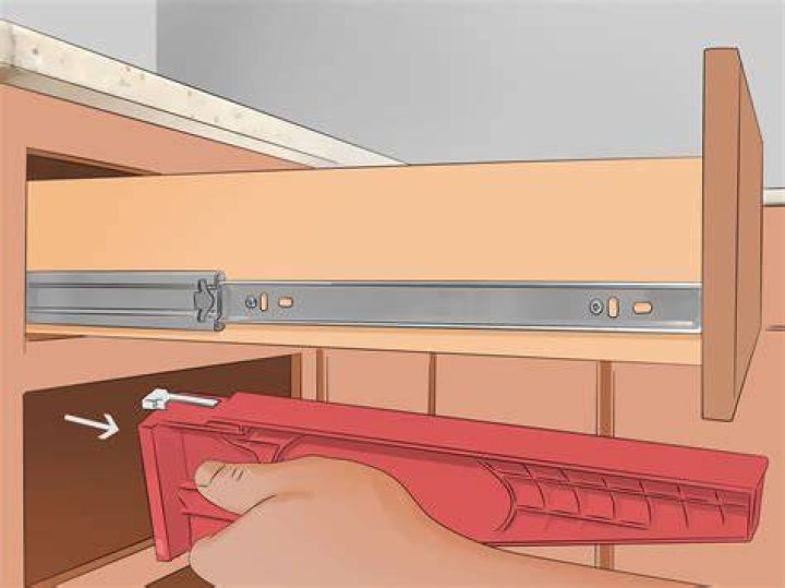 How do you get a dresser drawer off the rails?