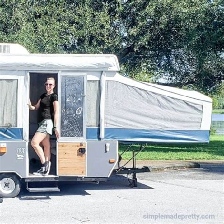 How do you open a pop up camper door without a key?