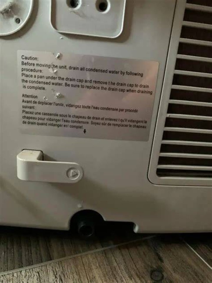 Why is my portable AC leaking water from the bottom?